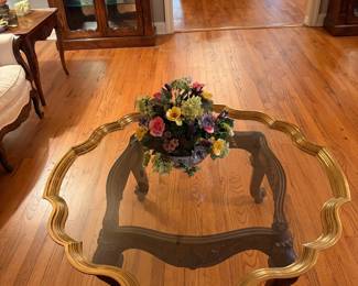 Glass top coffee table with ornate gold tone carved Hollywood Regency 
