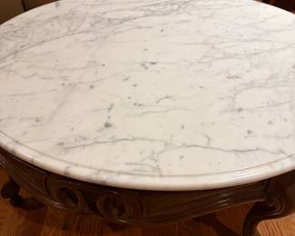 Marble top coffee table with carved wood base
