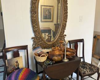 Mirrors; anique chairs; wood bowls