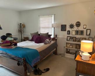 Bed and mattress; dresser and vanity; mirrors; brass coat stand