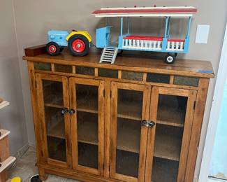 Glass and oak book case plus tractor towing a tram