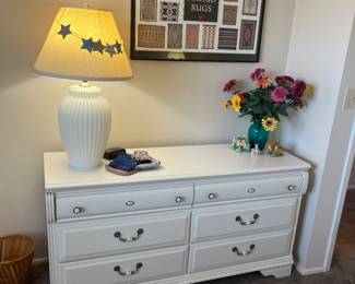 Framed print, table lamp, white dresser with matching single nightstand, decor