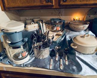 Marmalade coffee maker, extra coffee caraf, butter, sugar/ creamer, mixing bowls with lids, covered casserole, loose silverware, hot pads