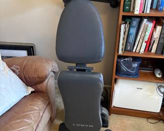 Lots of exercise equipment and weights 
