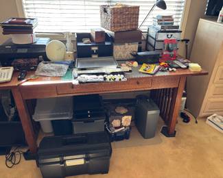 Desk with office supplies.    Wii game 