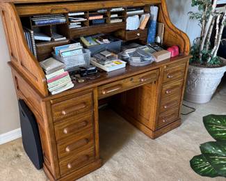 Roll top desk with lots of stationary 