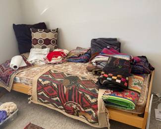 trundle bed, pillows, tapestry, quilts 
