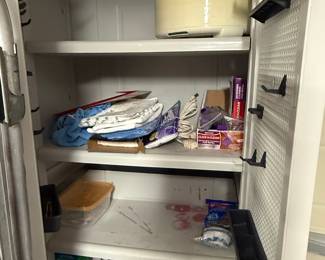 Plastic Storage Cabinet with Assorted Cleaning Supplies