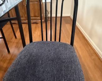 Modern Glass Top Dining Table with Black Metal Chairs