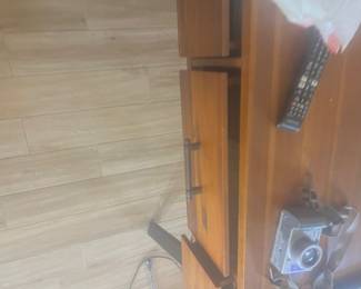 wooden cabinet, it has a fairly simple, modern design with that dark metal bar pull. $50