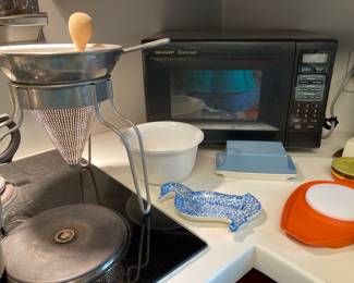 Sharp microwave, aluminum sieve, GE milkglass mixing bowl, vintage Tupperware