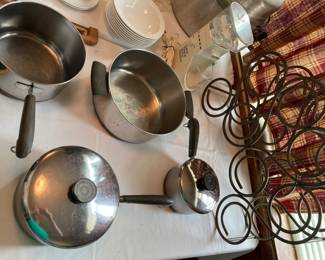 pre-1968 Revere Ware pots and pans, wine rack