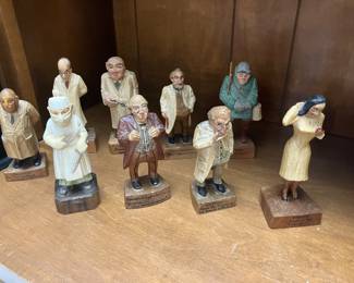carved wood doctors, nurse, and one fisherman