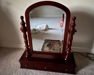 Pivoting mirror and drawer. Maybe used on top of chest of drawers 