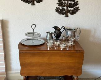 Beautiful tea cart with glass shelf.