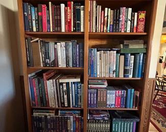 Books and vintage clam shell Disney vhs tapes