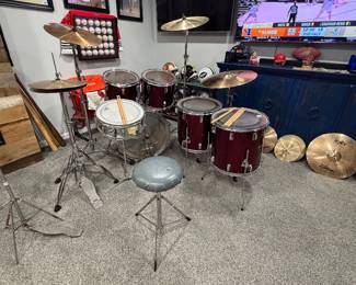 Dreams- CB-700 (Japan 70’s/ 80’s manufactured by Pearl) 6pc Kit w/ Rogers 14” Snare, (2) 80’s Tama straight cymbal stands, (1) 80’s Tama boom stand, 80’s Tama Hi-Hat Stands (all w/ quick release adjustments), incl. vintage slinger land Hi-Hat (missing seat cup & cymbal net), Slingerland Kick Pedal, Vint. Throne, (Snare 14”, Toms 12”, Toms 13”, Toms (2) 16”, Bass 22”) Cymbals- Meinl (Germany) Headliner Crash 16”, Zildjian 18” China Boy High(is cracked) Full set of Zildjian ZXT Cymbals- 20” Medium Ride, 14” Hi-hat Pair, 18” Crash Ride, 14” Total China 12” Zillow (made by Zildjian) Heavy Crash 10” Zildjian A Extra Thin Splash (cracked) 14” Vintage Zildjian Hi-Hats Pair USA 4 Sets Nylon Tip Drumsticks  
