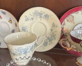 Assorted Vintage Porcelain Teacups and Saucers with Floral Motifs fourth image