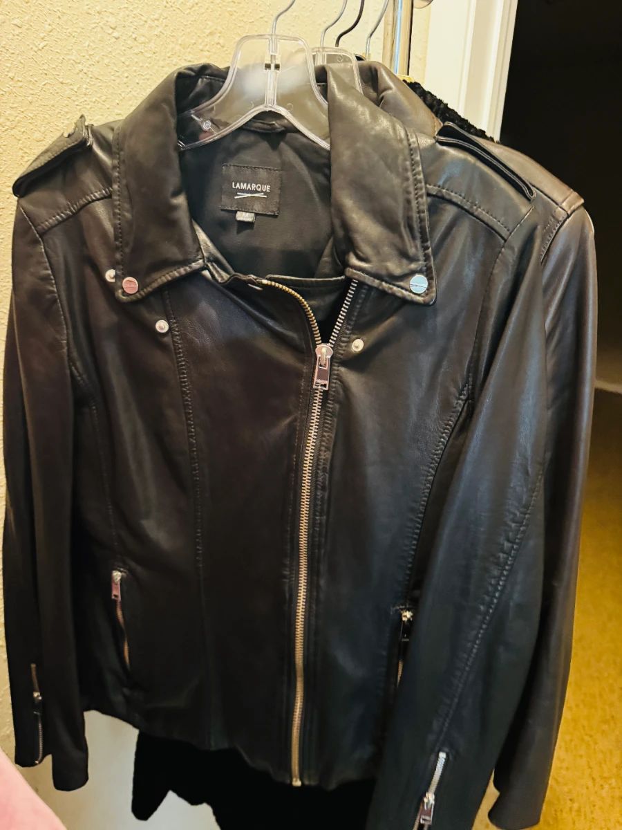 Lamarque Black Leather Moto Jacket - size Medium -  A premium black leather moto/biker jacket by Lamarque, a Montreal-based brand known for high-quality lambskin leather. Features an asymmetric zip front, silver-tone hardware, epaulet shoulder details, and zip pockets. Classic, timeless style that never goes out of fashion. Pre-owned condition.
