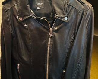 Lamarque Black Leather Moto Jacket - size Medium -  A premium black leather moto/biker jacket by Lamarque, a Montreal-based brand known for high-quality lambskin leather. Features an asymmetric zip front, silver-tone hardware, epaulet shoulder details, and zip pockets. Classic, timeless style that never goes out of fashion. Pre-owned condition.