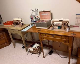 Two older Singer sewing machines in original cabinets
