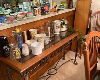 Great sofa table that matches the coffee table in the living room. Nice selection of vases - with more in the garage