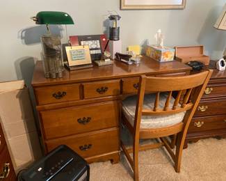 Small size student office desk and chair, along with an assortment of office supplies
