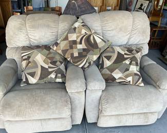 Two recliners with pillows