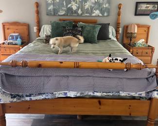 Pine for poster bed with two nightstands, an armoire, and a chest of drawers