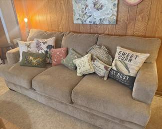 couch, throw pillows, floral art