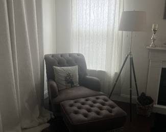 Leather tufted armchair with matching footstool ottoman. Tripod lamp. 