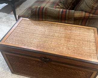 Wicker and wooden antique trunk with brass latch.