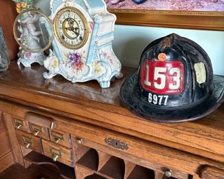 Fire helmet, antique mantel clock, 