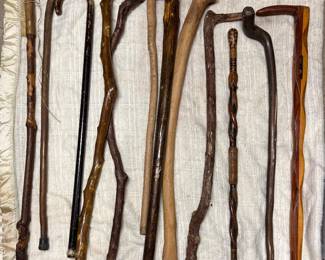 Collection of 12 hand carved canes