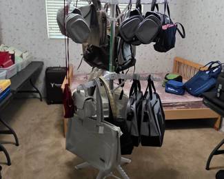 Assorted handbags, backpacks, and travel bags
