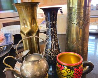 Note vases in back made of shell casings from Israel. (Shown Left and right)