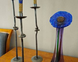 Artisan iron candle holders and purple glass vase with blue collar
