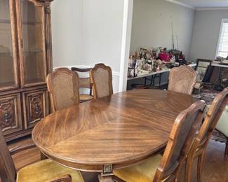 1970s dining table with gold Velour chairs with cane backs. Also has a leaf.