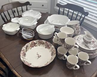 Awesome wood table and chairs, corning wear and dishes.