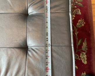 Metallic cushioned bench seat with wooden legs $100 + tax 