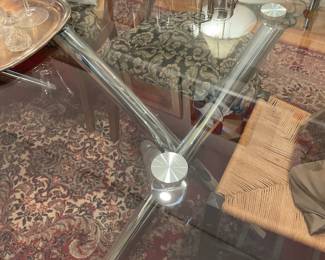 Glass top rectangular dining table with chrome crisscross legs $1250 + tax