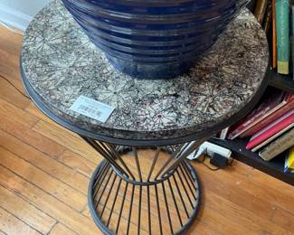 Round side table with black spokes and stone patterned resin top $100 + tax