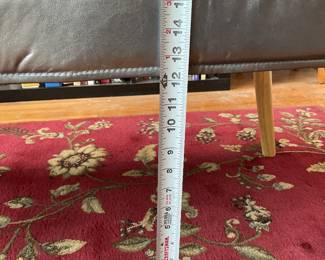 Metallic cushioned bench seat with wooden legs $100 + tax 