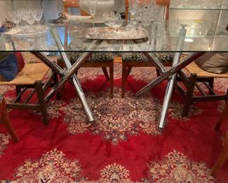 Glass top rectangular dining table with chrome crisscross legs $1250 + tax