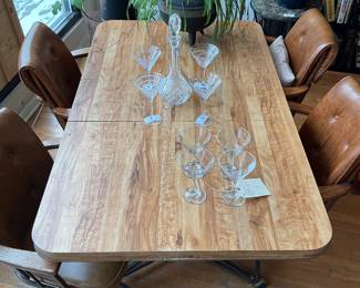 MCM laminate dining set with removable leave and leather executive chairs $2000 + tax