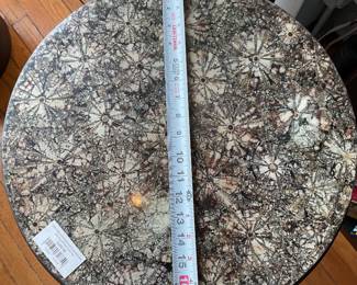 Round side table with black spokes and stone patterned resin top $100 + tax