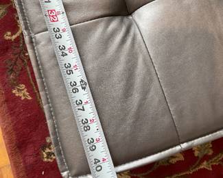 Metallic cushioned bench seat with wooden legs $100 + tax 