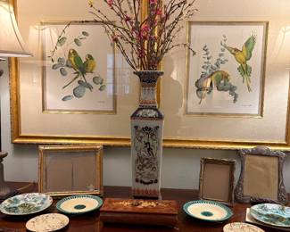 Beautiful prints, majolica and Chinese vase in primary suite.