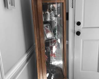Corner glass front cabinet.