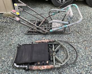 Two Hunting Tree Stands with Metal Frames and Camouflage Materials